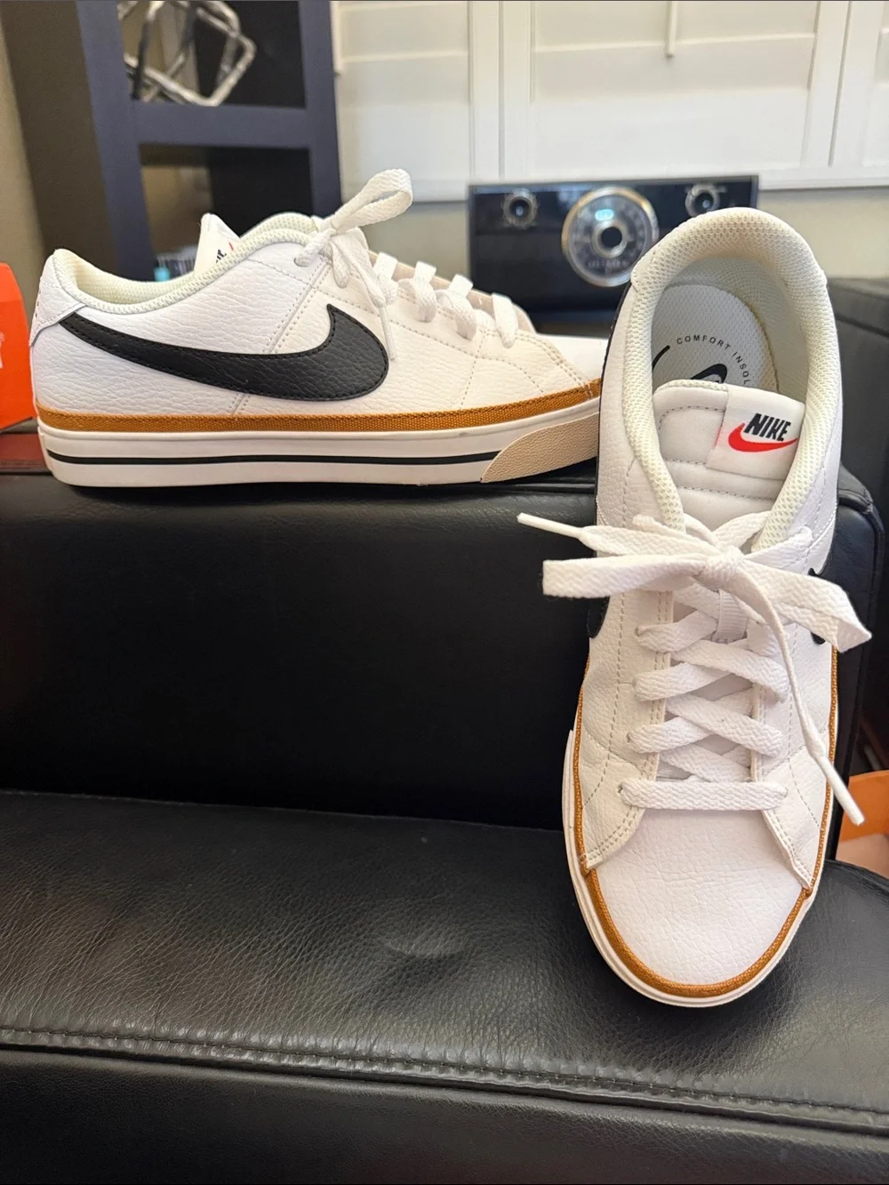Nike White Low-Top Sneakers with Black Swoosh and Brown Trim